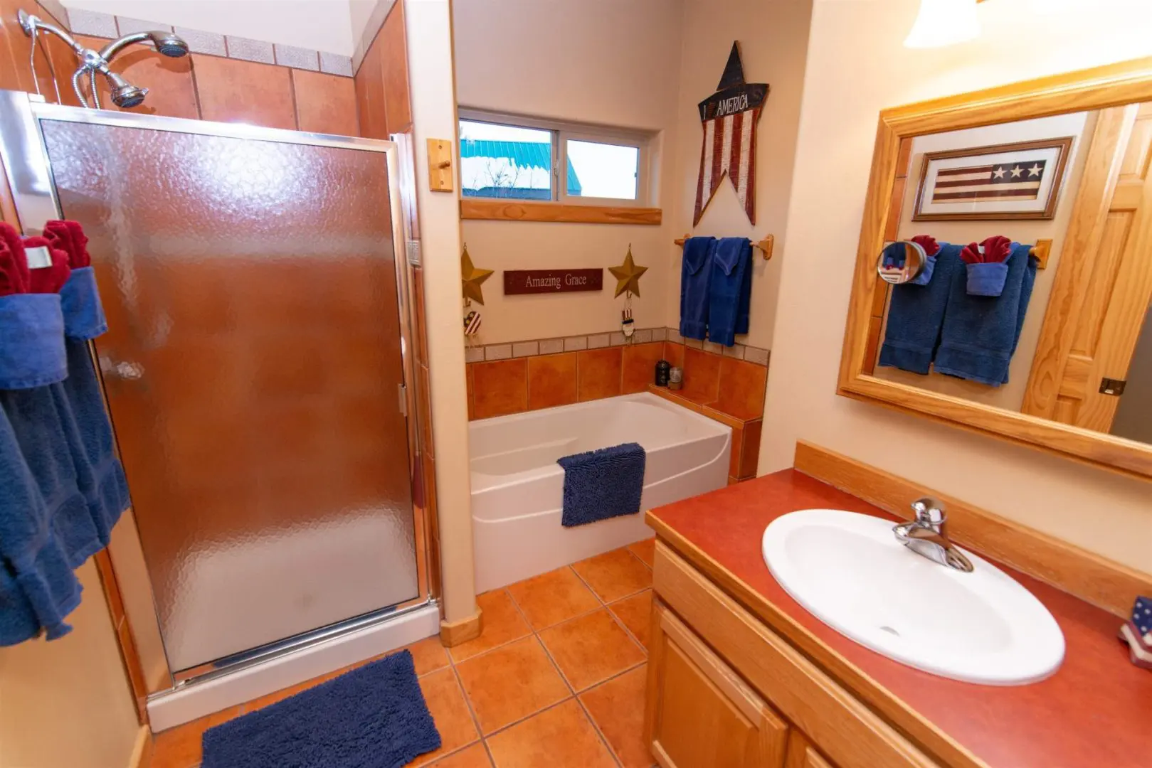 A bathroom with a shower and a sink.