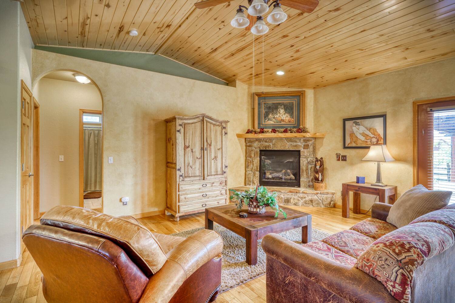 A living room with a fireplace.