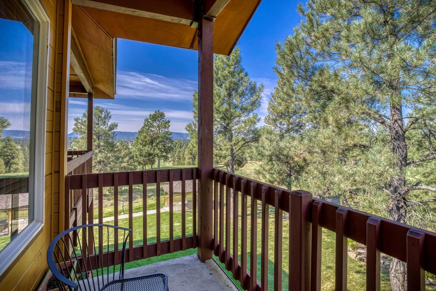 A balcony with a view of the mountains.