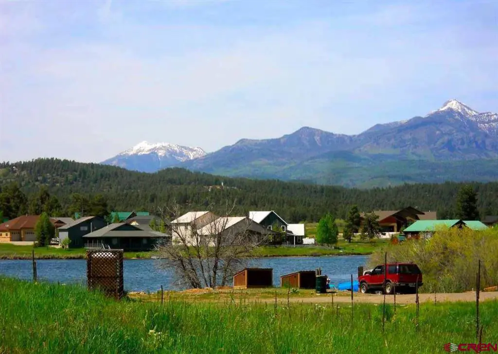 A view of a lake with mountains in the background.