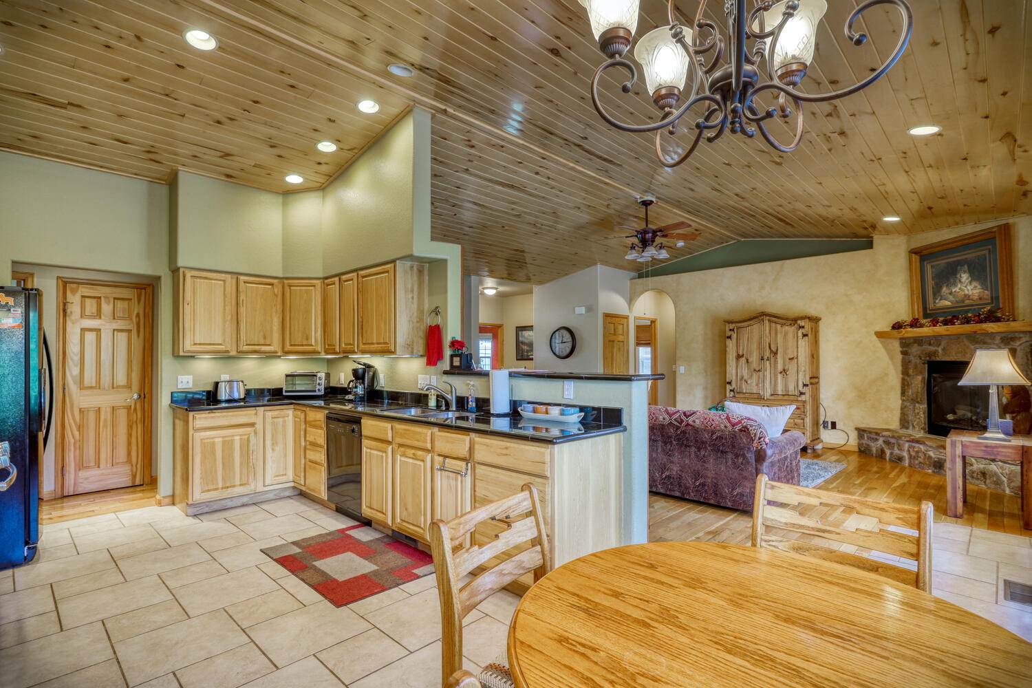 A kitchen and dining area in a log cabin.