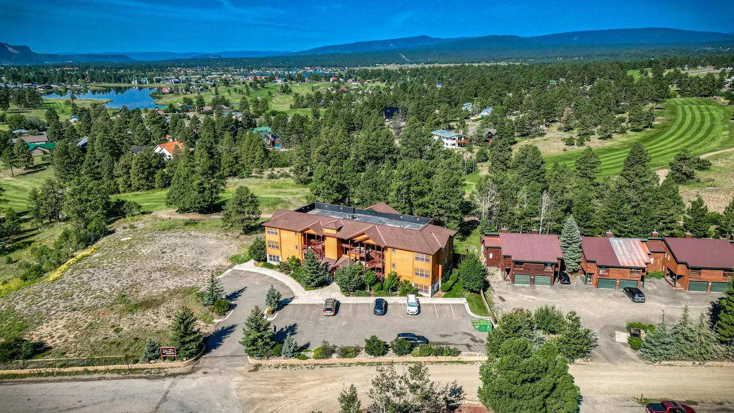 An aerial view of a resort in the mountains.