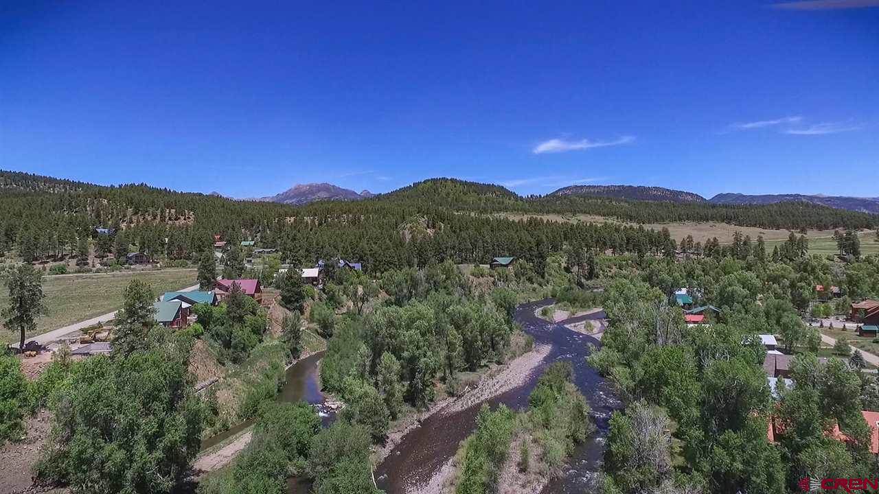 An aerial view of a small town in the mountains.