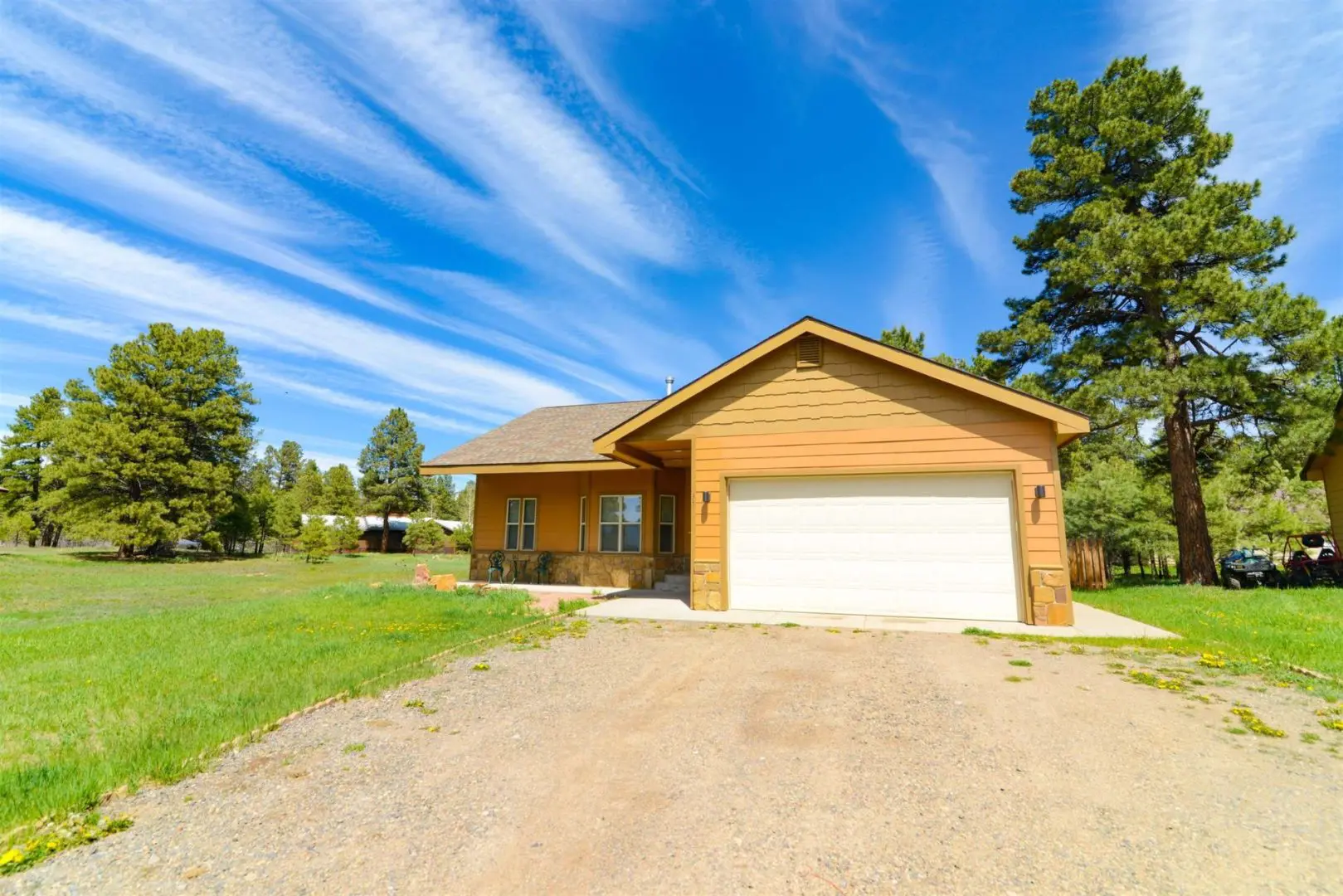 A house with a garage in front of it.