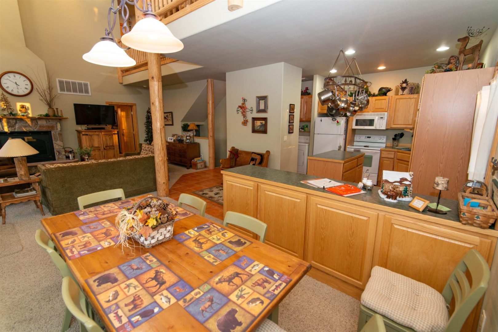 A living room with a dining table and chairs.