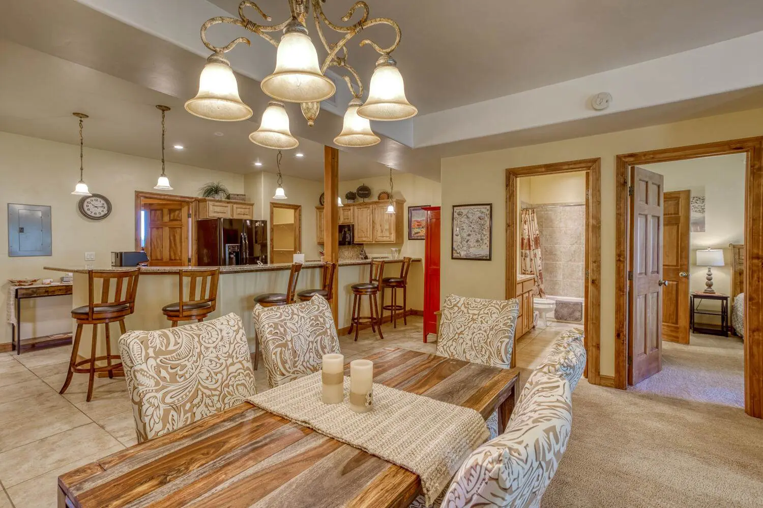 A living room with a dining table and chairs.