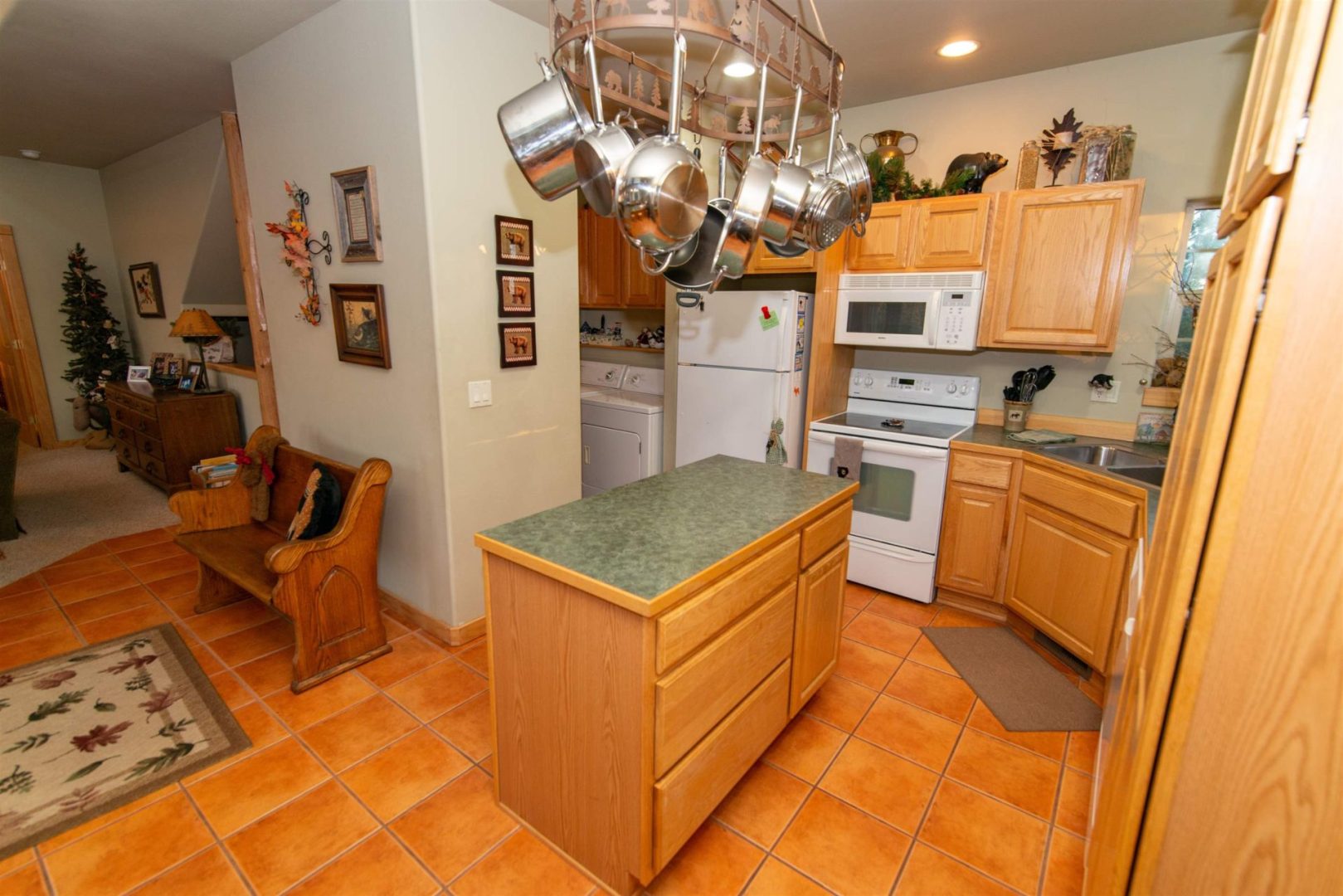 A kitchen with pots and pans on the counter.