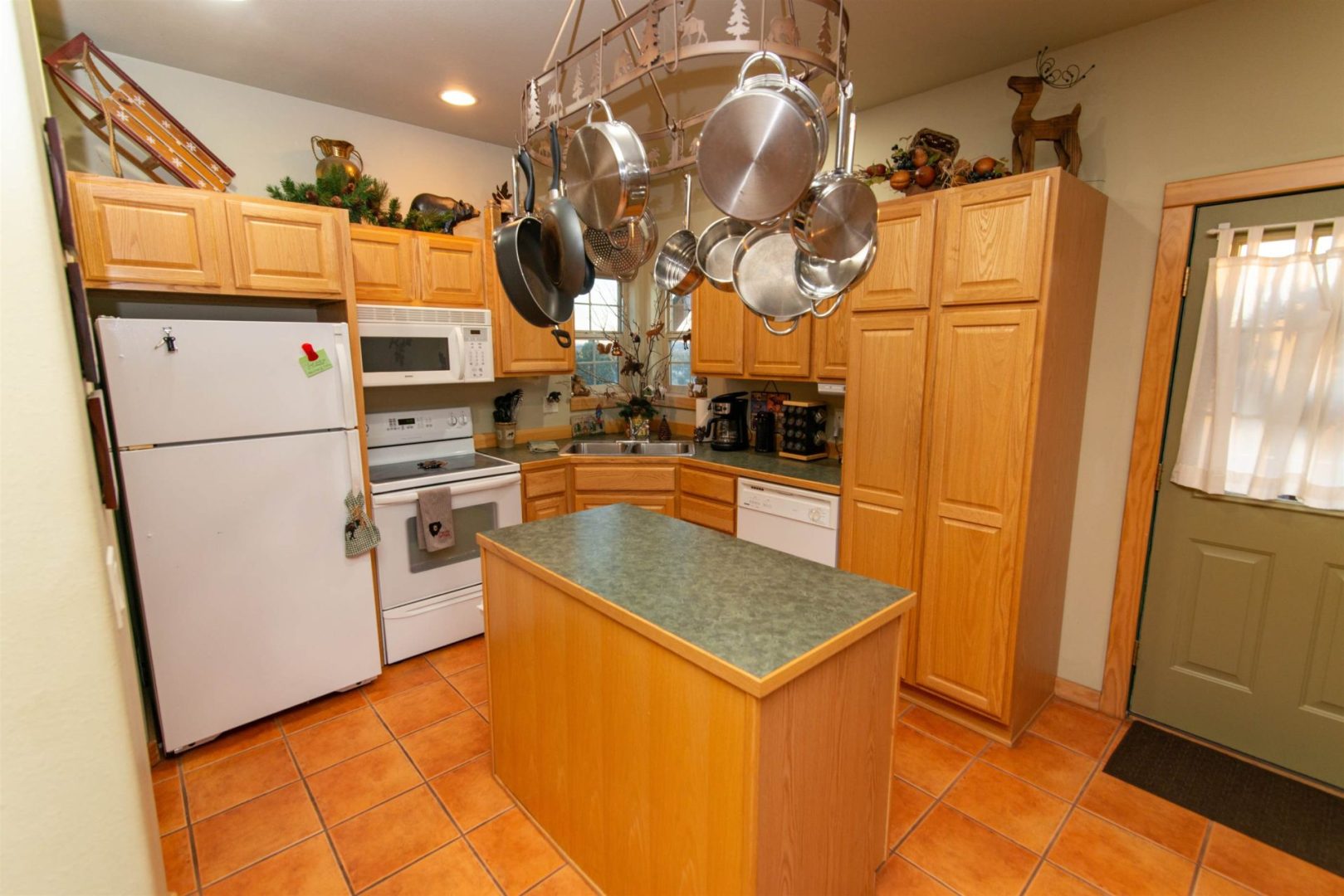 A kitchen with pots and pans on the counter.