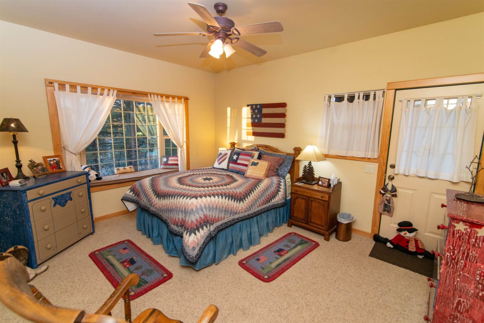 A bed with an american flag on it.