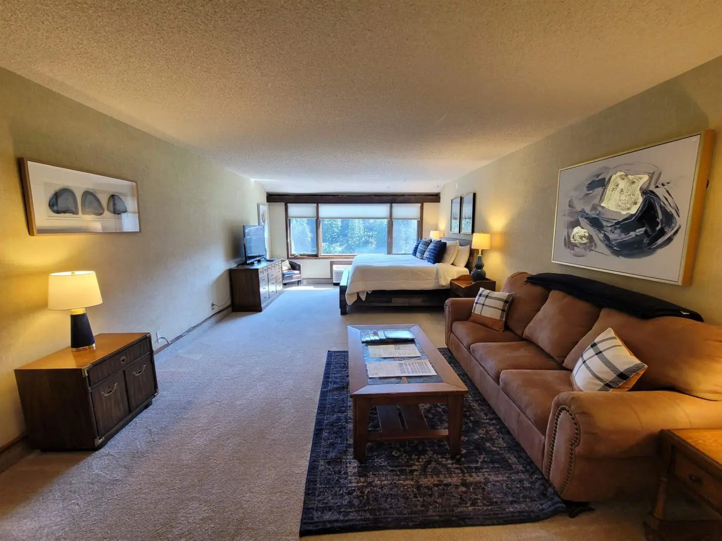 A living room with a couch and tv.