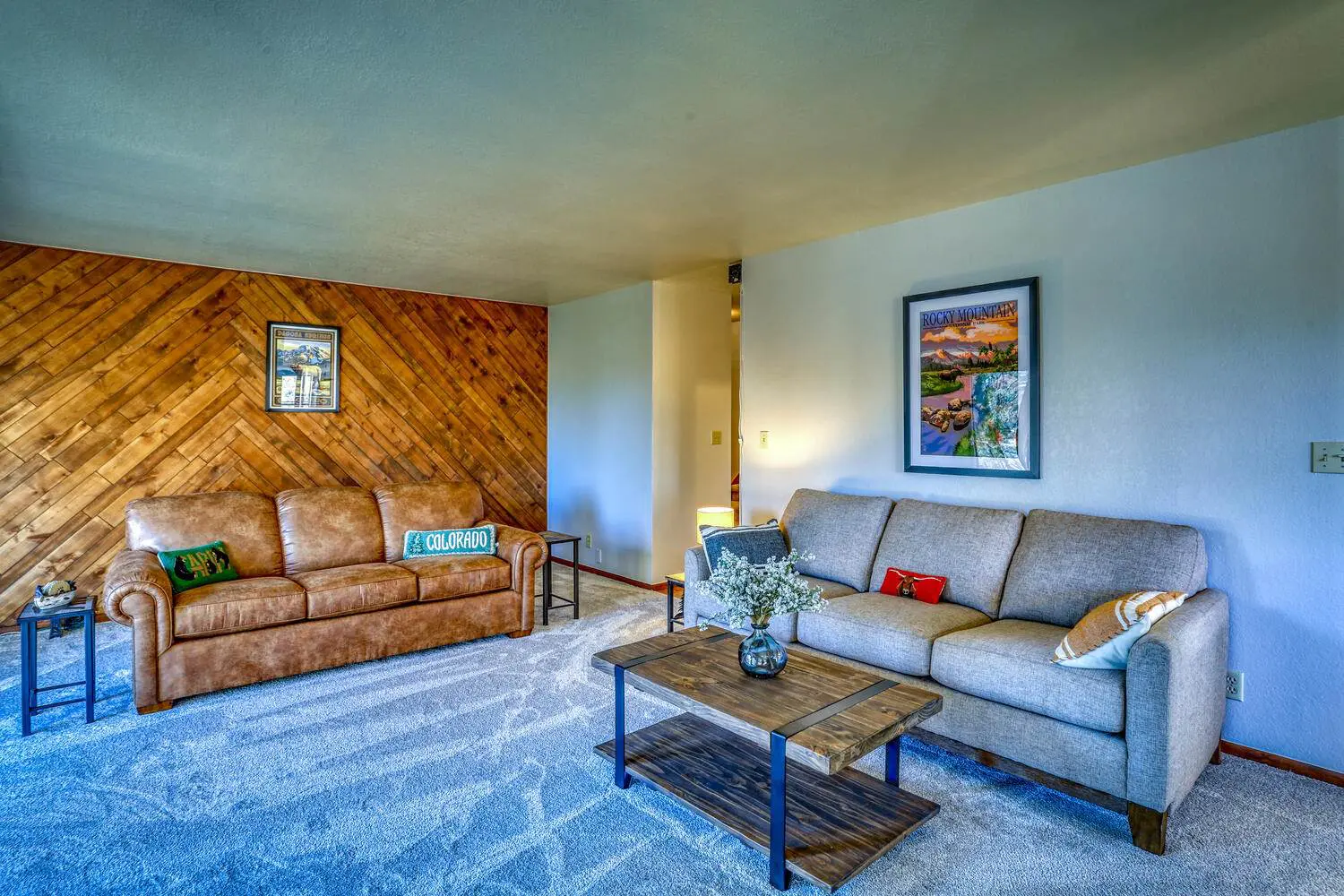 A living room with couches and a coffee table.