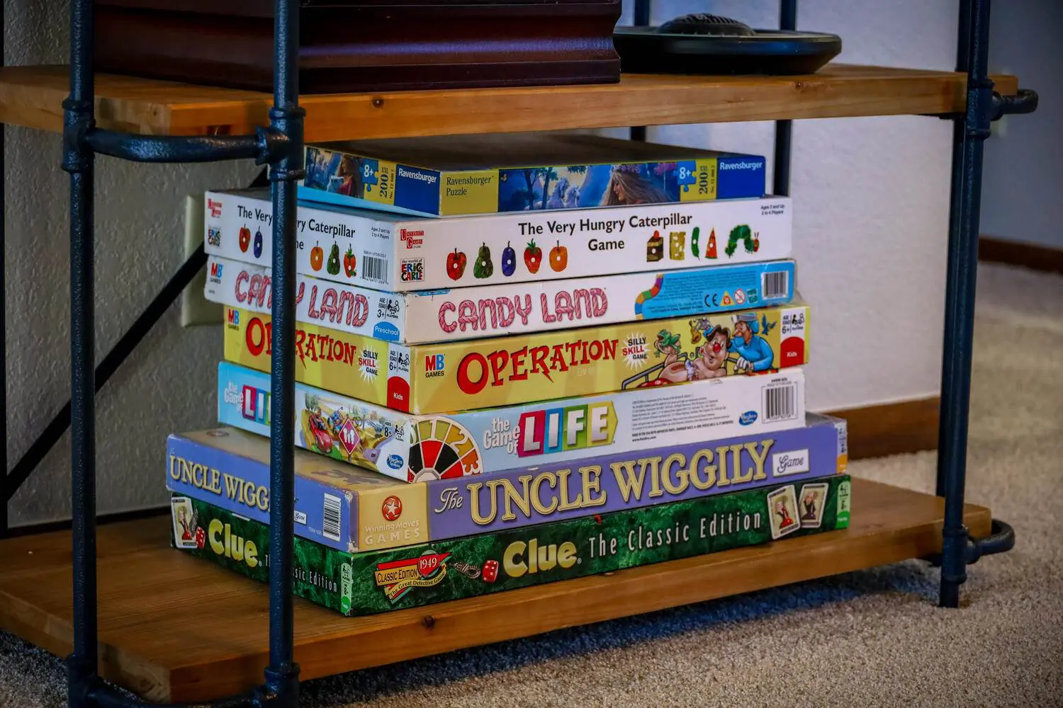 Some books kept on a table along with some objects