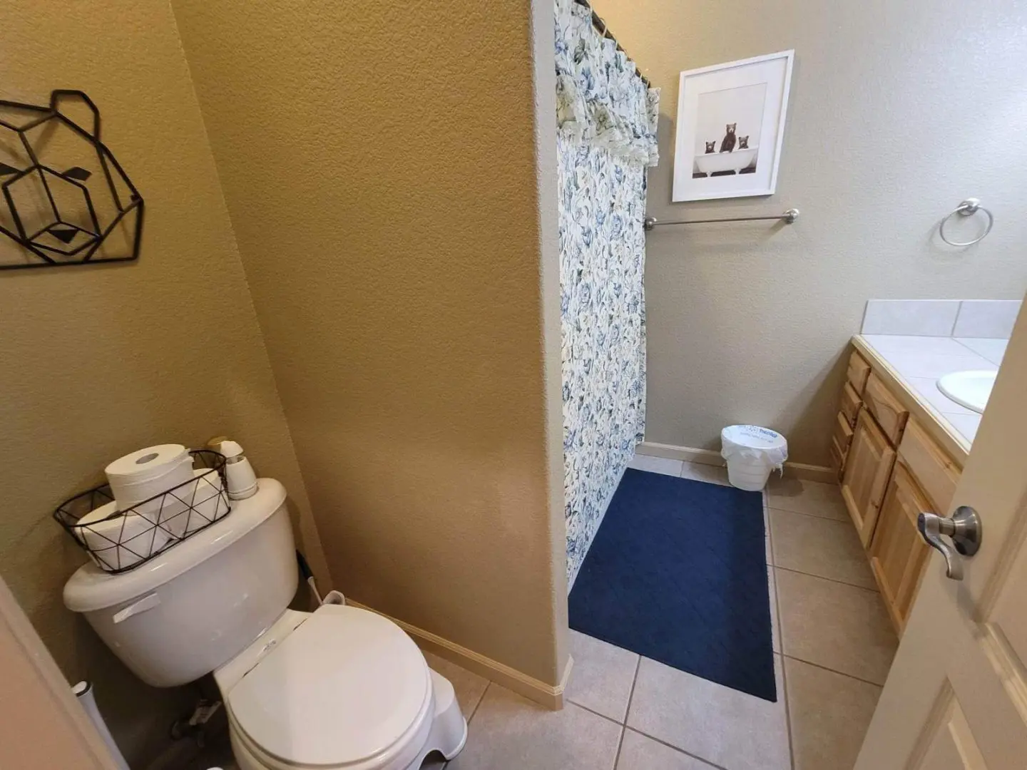 A bathroom with a toilet and shower.