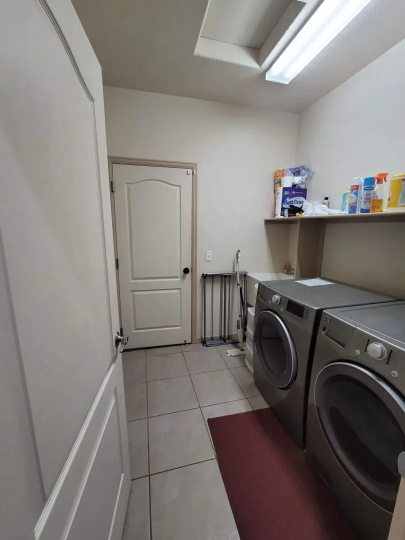 A laundry room with a washer and dryer.