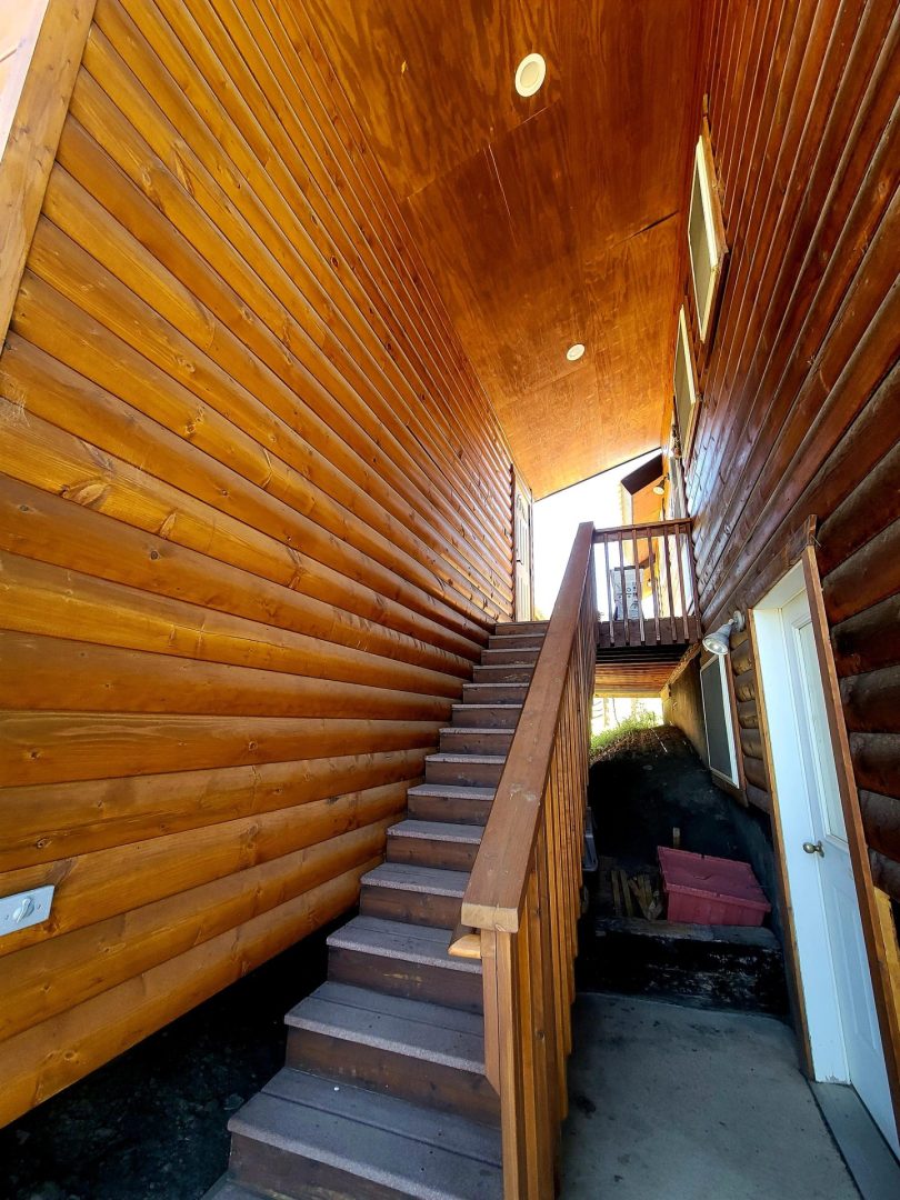 Stairs going upward with so many wooden walls