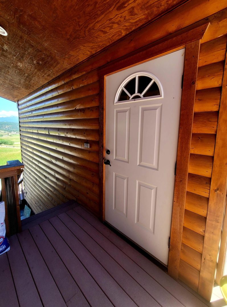 A white color door inside a house by wooden design