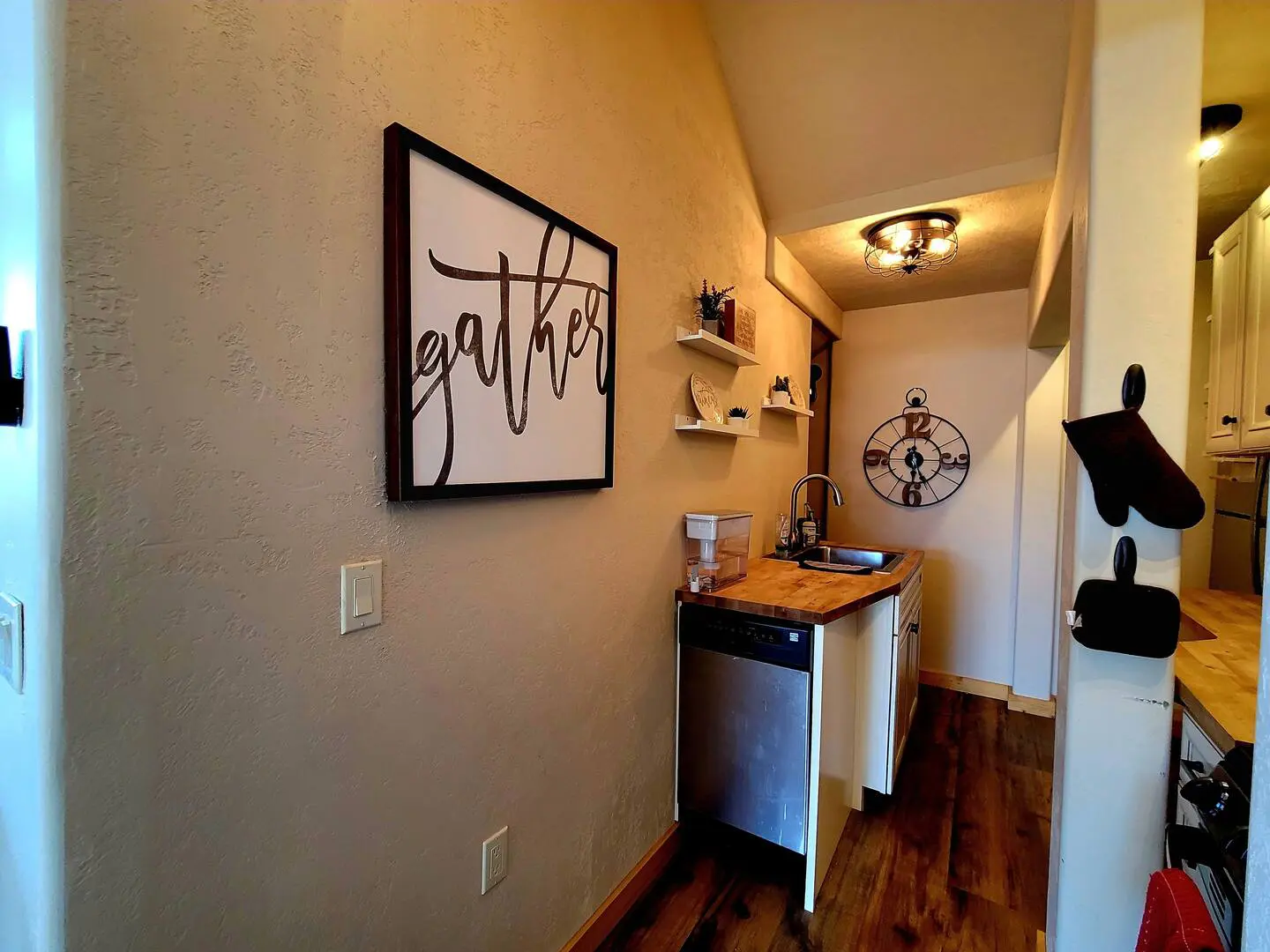 A kitchen or kitchenette at a cabin in the woods.