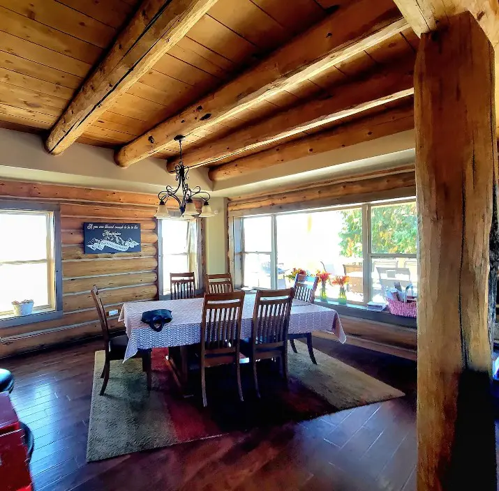 A dining room in a log cabin.