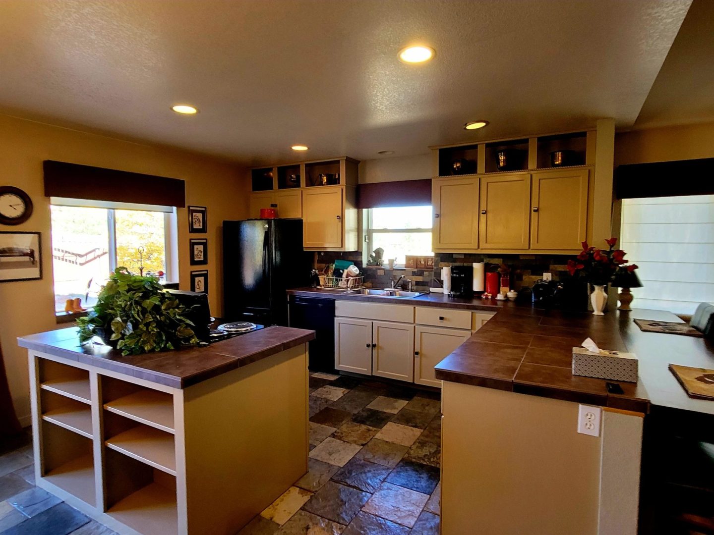 A kitchen with tile floors and a counter top.